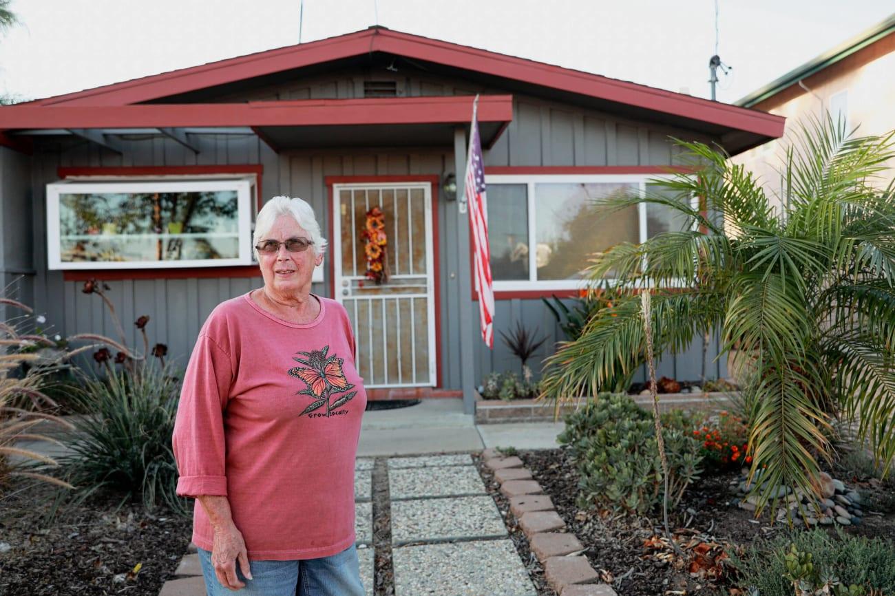 Margie Coats in front of her home in the Clairemont neighborhood of San Diego.