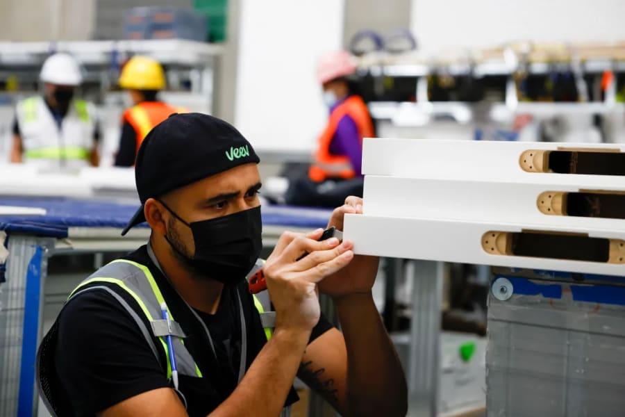 SAN FRANCISCO CALIFORNIA – OCTOBER 14: A factory employee works at the Veev warehouse in Union City, Calif., on Thursday, Oct. 14, 2021.