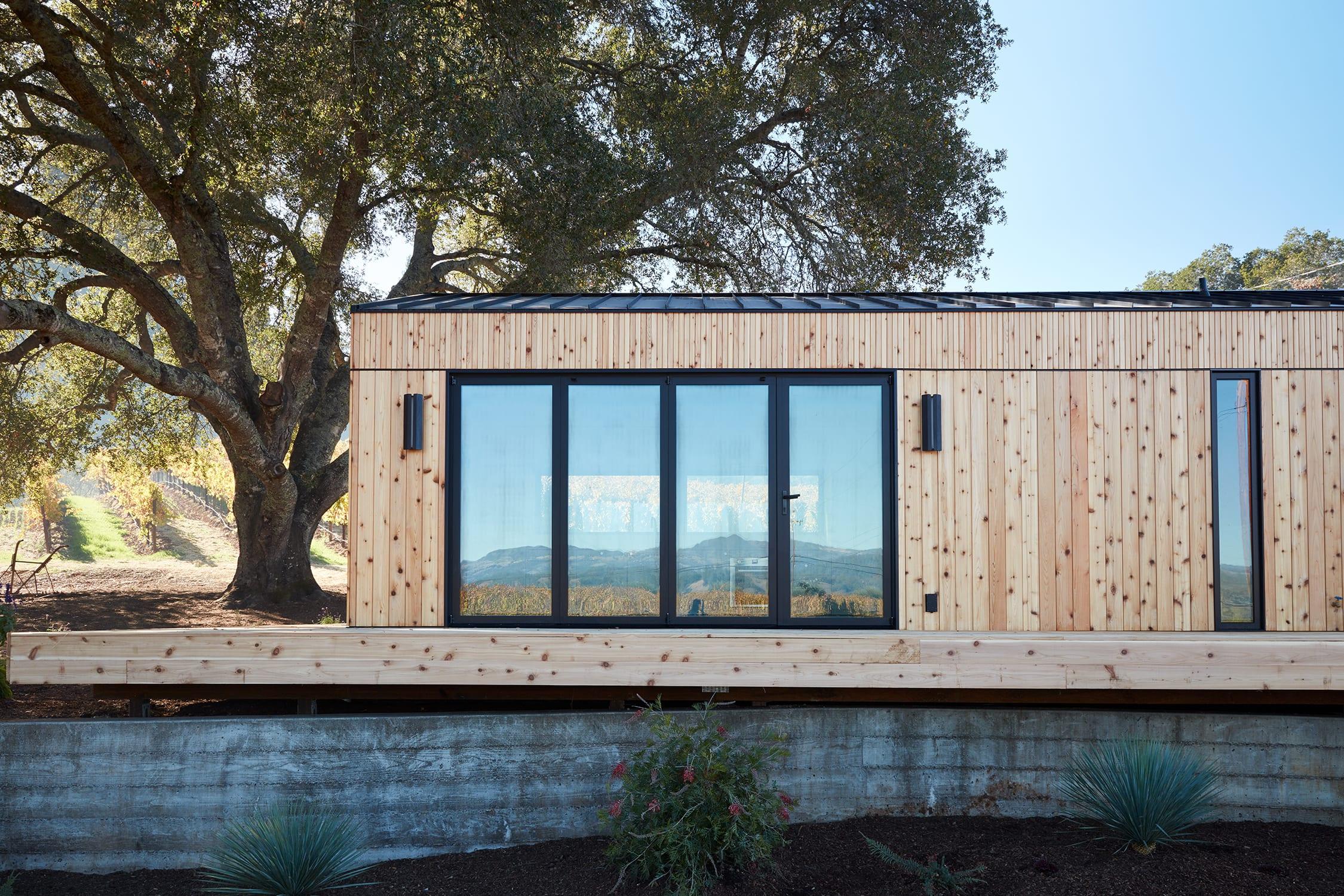 Abodu One kitchen and living room in a spacious backyard